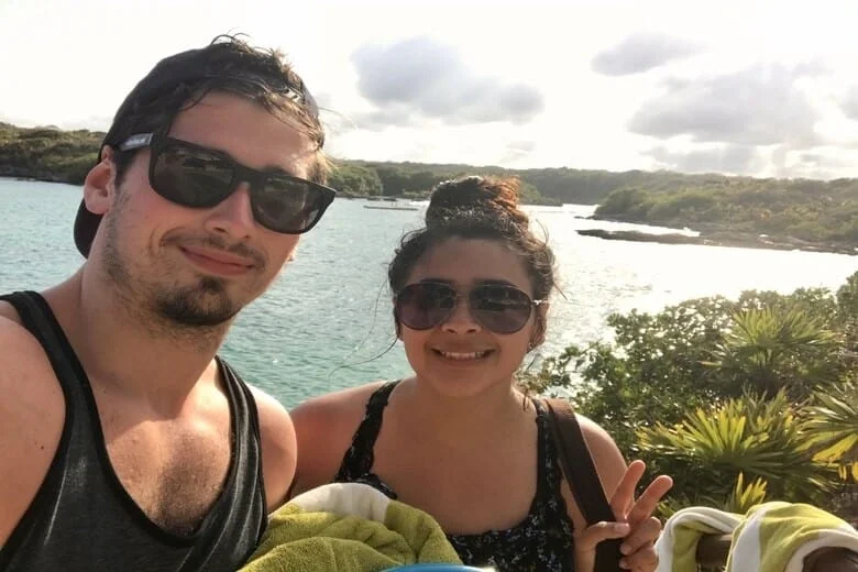 alex white-gomez, founder of mexicotravelbuddy.com with his mexican wife after a swim