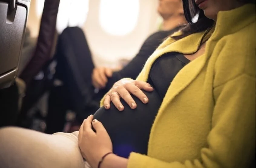 a pregnant traveler on the plane to Mexico