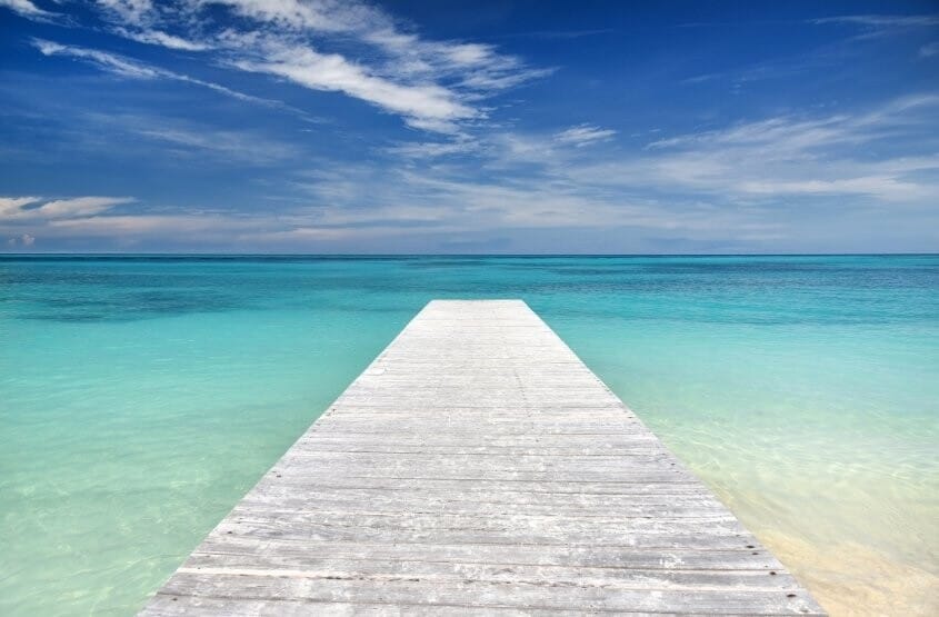 A long bridge leading into the ocean in Mexico.