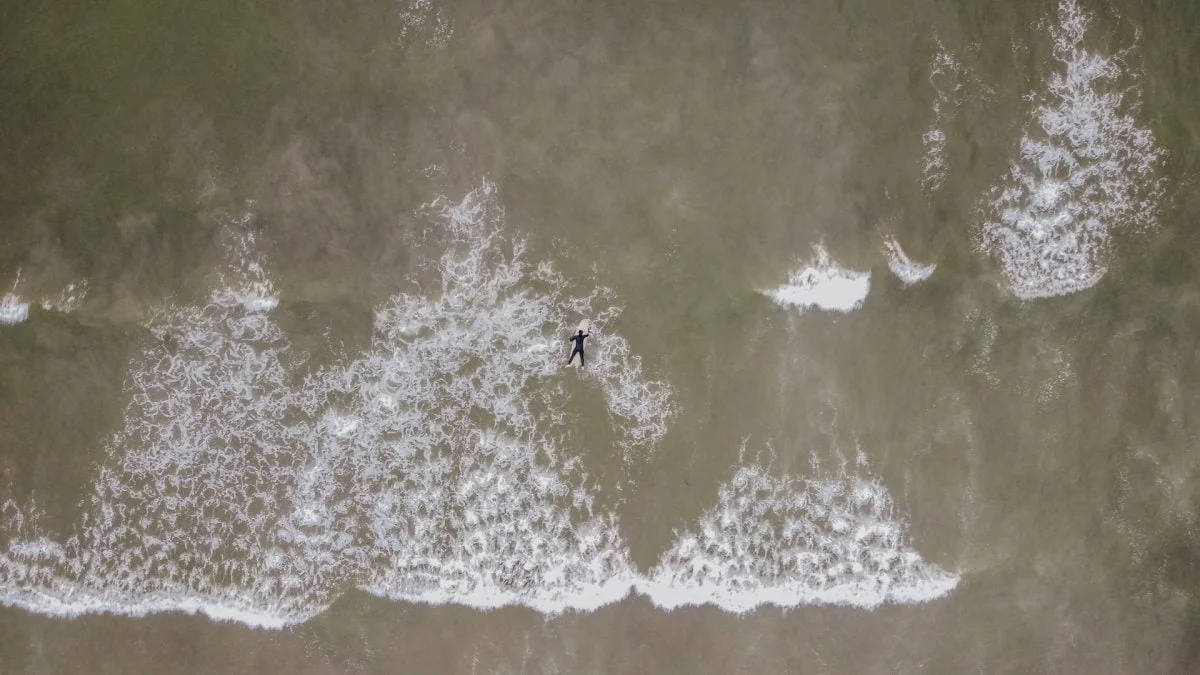 person surfing on ocean waves during daytime in ensenada mexico