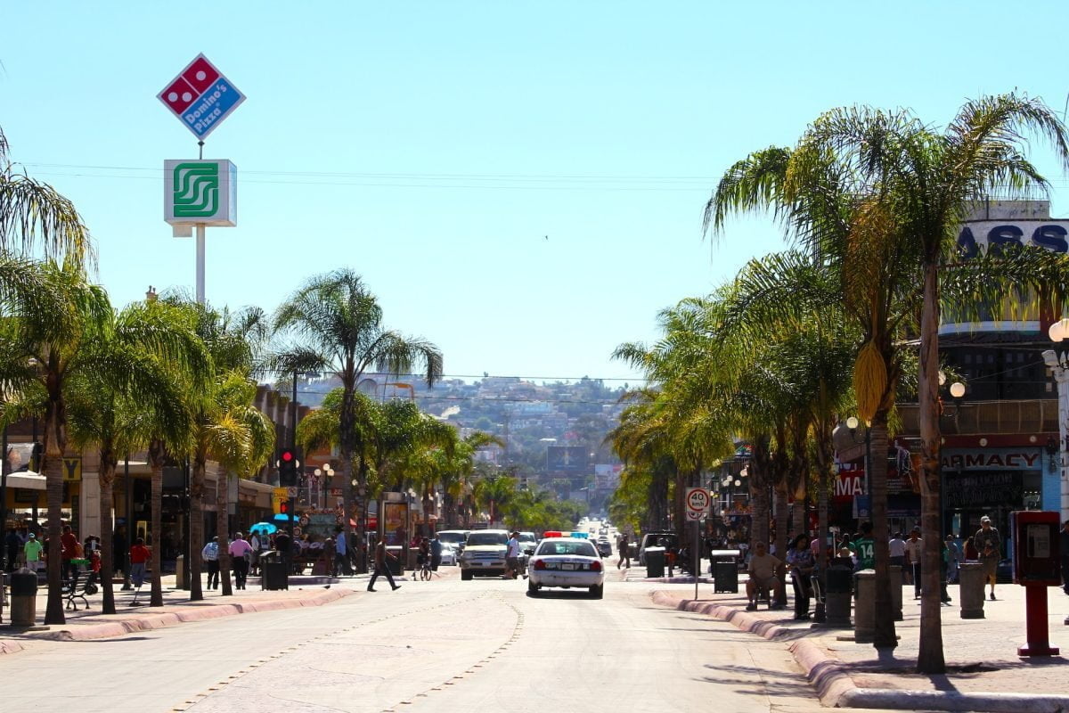 police cars driving in Avenida Revolución, Tijuana, Baja California, Mexico