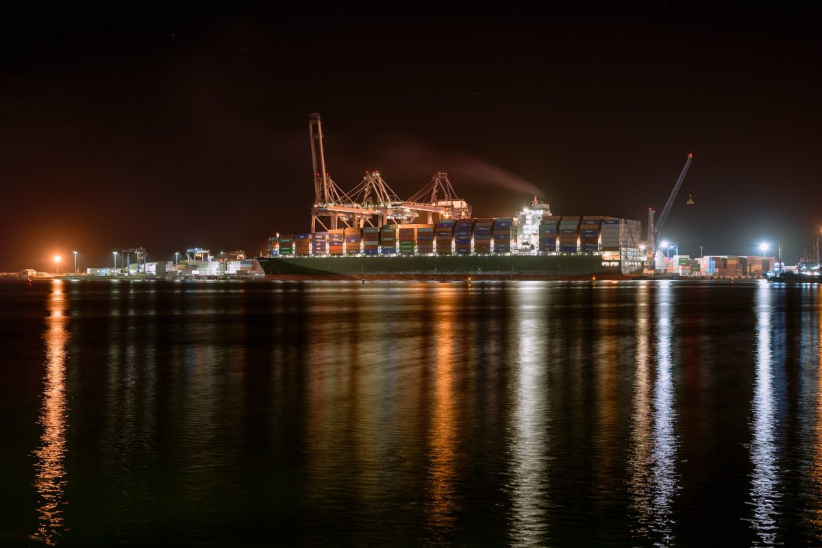 red and white ship on sea during night time Puerto de Ensenada